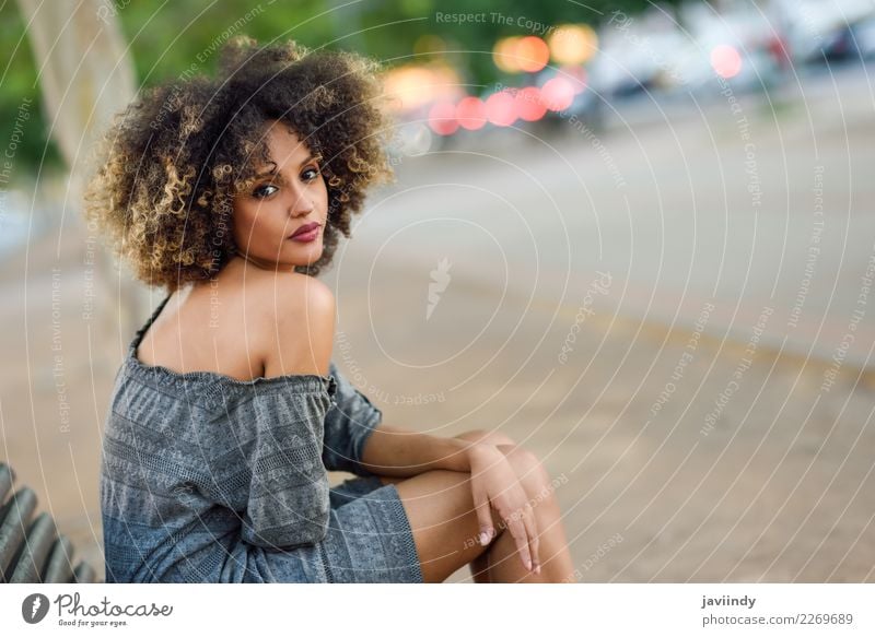 Black woman with afro hairstyle sittin on a urban bench Lifestyle Style Beautiful Hair and hairstyles Human being Feminine Young woman Youth (Young adults)