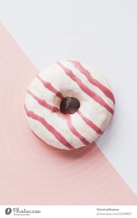 Top view of pink donut on white and pink background Food Dough Baked goods Cake Dessert Breakfast Decoration Feasts & Celebrations Movement Pink White Colour