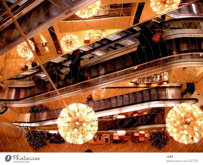 in a department store Mall Shopping center Light Escalator Fairy lights Bundle Transport Life Architecture buying country Karstadt Rolling stairs Human being