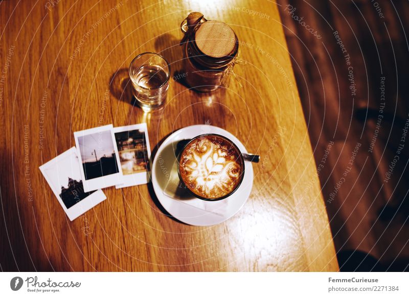 Instant pictures and coffee on wooden table Breakfast To have a coffee Beverage Coffee Leisure and hobbies Coffee cup Cappuccino Instant camera Polaroid