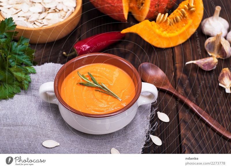 thick pumpkin soup Vegetable Soup Stew Herbs and spices Nutrition Eating Lunch Dinner Vegetarian diet Diet Bowl Spoon Decoration Table Kitchen Hallowe'en Nature