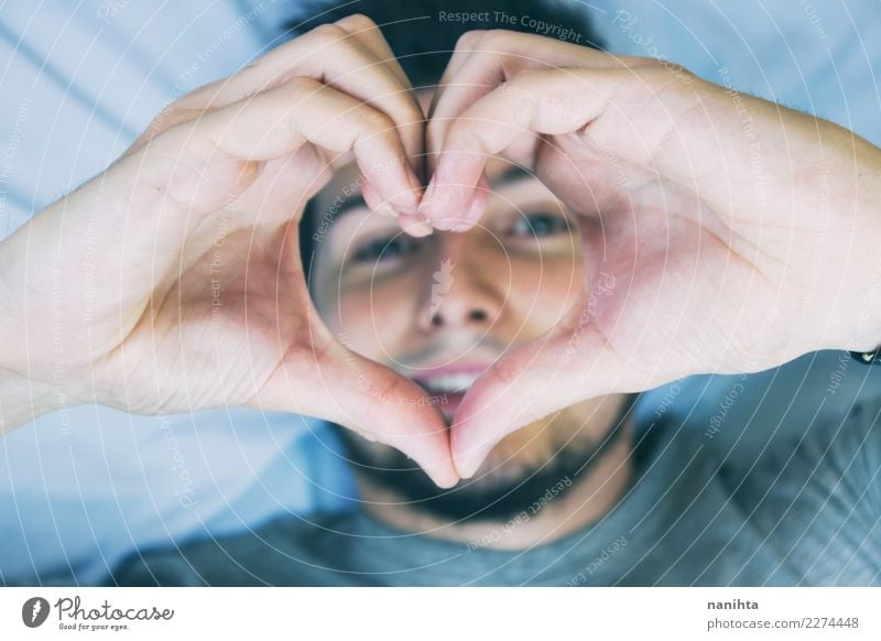 Young man making a heart shape with his hands Design Healthy Health care Human being Masculine Youth (Young adults) Man Adults 1 30 - 45 years