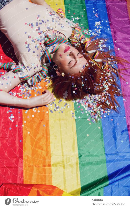 Young woman sleeping over a rainbow flag Lifestyle Style Design Beautiful Senses Relaxation Party Event Going out Feasts & Celebrations Human being Feminine
