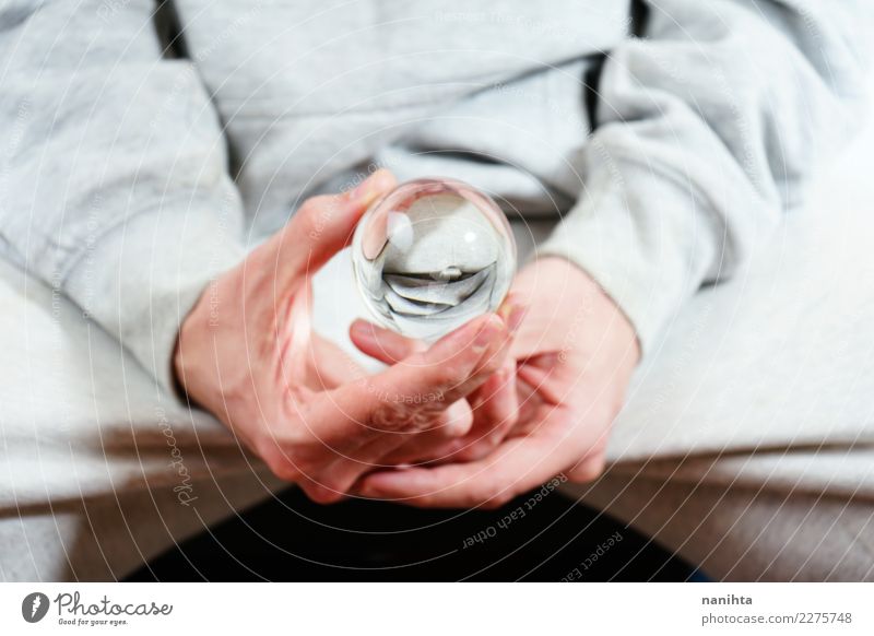 Man holding a crystal ball Design Human being Masculine Young man Youth (Young adults) Adults Hand Sweater Crystal ball Glass Ball Sphere To hold on Simple