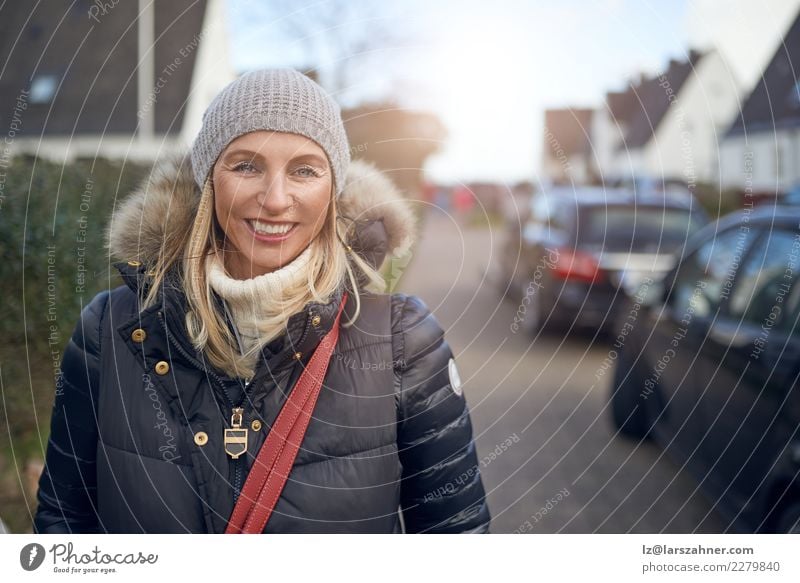 Smiling happy woman outdoors on a cold winter day Happy Beautiful Face Leisure and hobbies Winter Woman Adults 1 Human being Autumn Weather Street Fashion