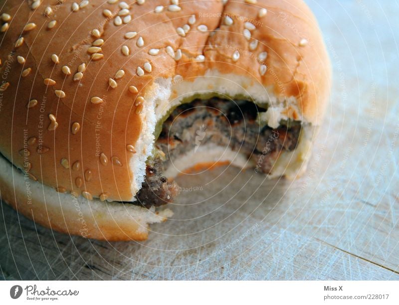 burgers Food Meat Roll Nutrition Fast food Delicious Fat Unhealthy Hamburger Cheeseburger Hearty Bite Colour photo Close-up Deserted Neutral Background Appetite