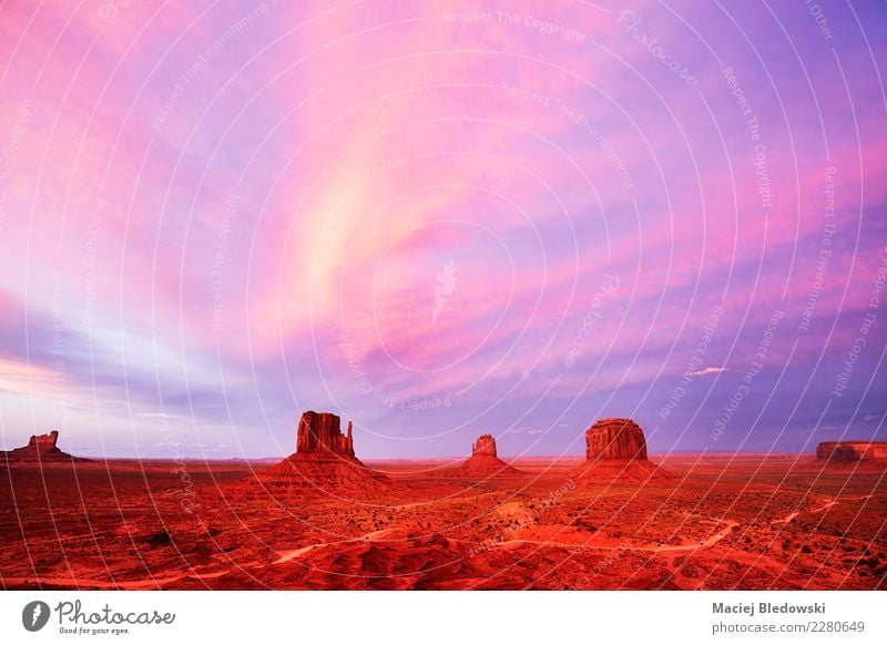 Purple sunset over the Monument Valley, USA. Vacation & Travel Tourism Trip Adventure Freedom Sightseeing Expedition Summer vacation Nature Landscape Sky Rock