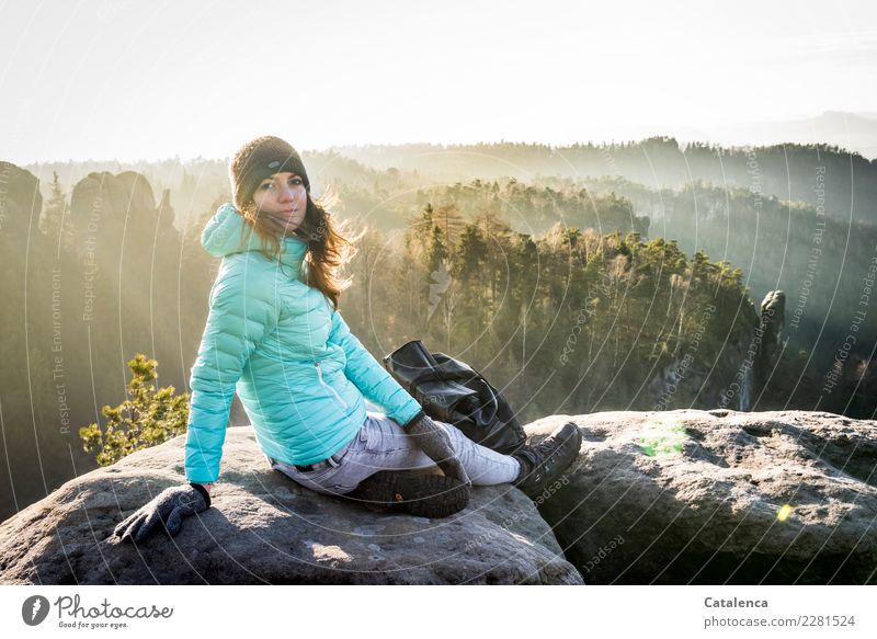 Sunlit young woman in winter Elbe Sandstone Mountains Feminine 1 Human being 18 - 30 years Youth (Young adults) Adults Landscape Sky Winter Beautiful weather