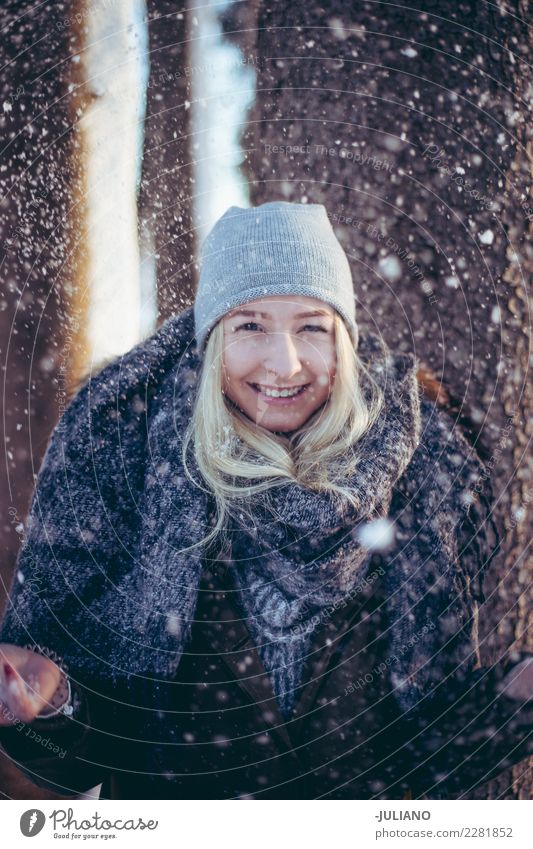 Young woman in winter throwing snow in the air Lifestyle Joy Trip Adventure Freedom Winter Snow Winter vacation Human being Feminine Youth (Young adults) Adults