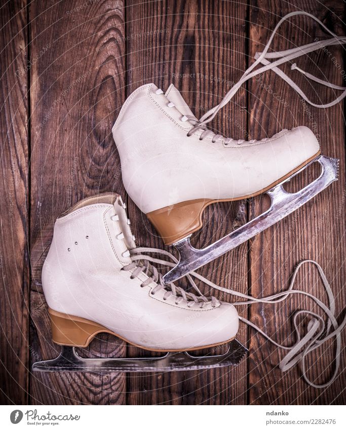 white leather skates for figure skating Elegant Leisure and hobbies Sports Winter sports Leather Footwear Wood Retro Brown White ice Figure background blade