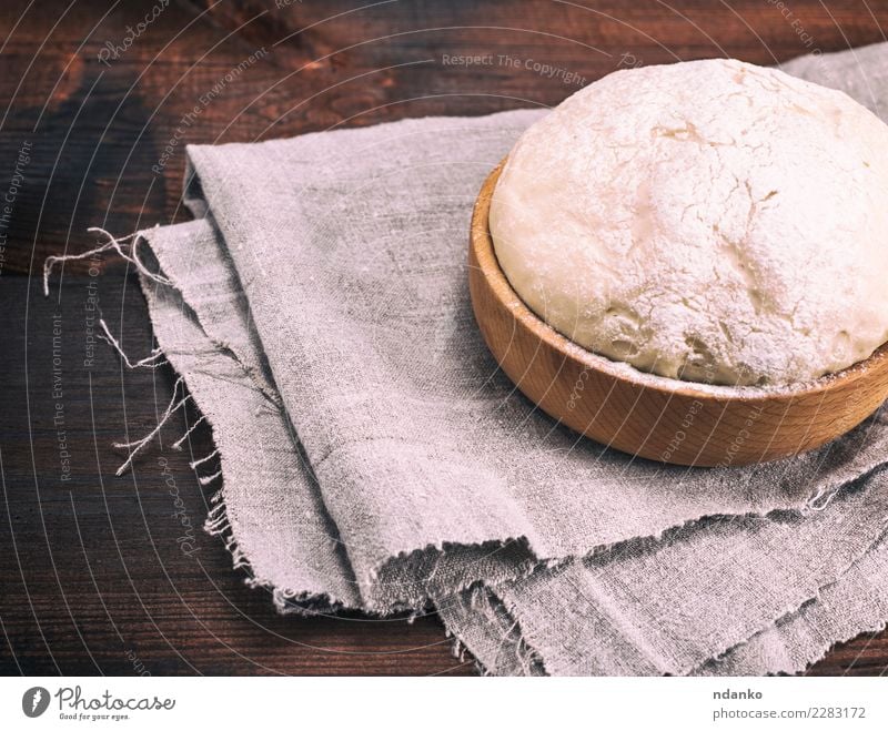 yeast dough in a wooden bowl Dough Baked goods Bread Bowl Table Kitchen Wood Fresh Natural Above Brown White Yeast background Preparation food healthy