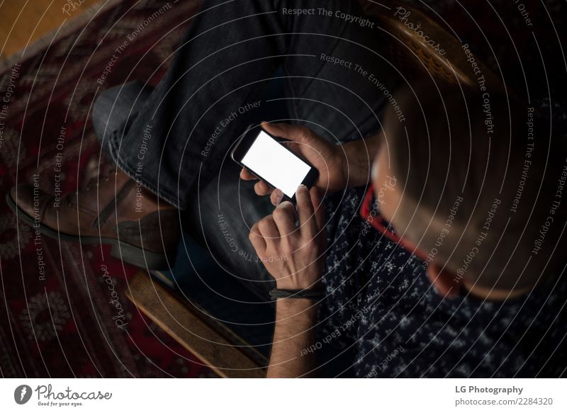 Man using mobile device. Style Relaxation Calm Flat (apartment) Telephone Technology Human being Adults Observe Sit Uniqueness Natural Red Perspective
