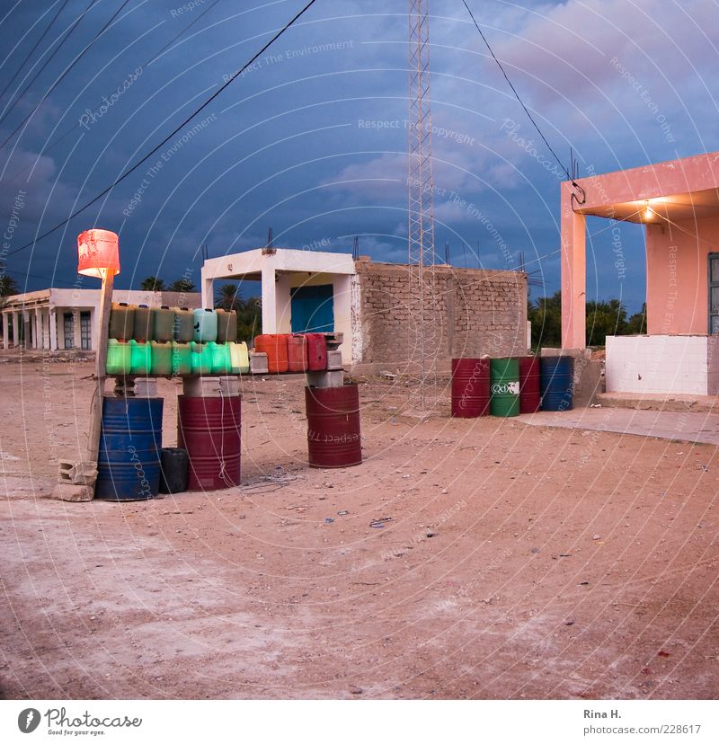 Last petrol station before the border Energy industry Energy crisis Tunisia Village Deserted Building Sand Wait Poverty Authentic Blue Pink Survive