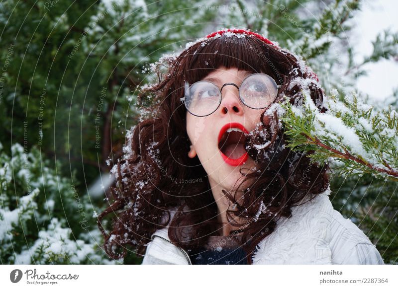 Young woman surprised in a snowy day Lifestyle Exotic Joy Hair and hairstyles Skin Face Vacation & Travel Freedom Expedition Winter vacation Human being