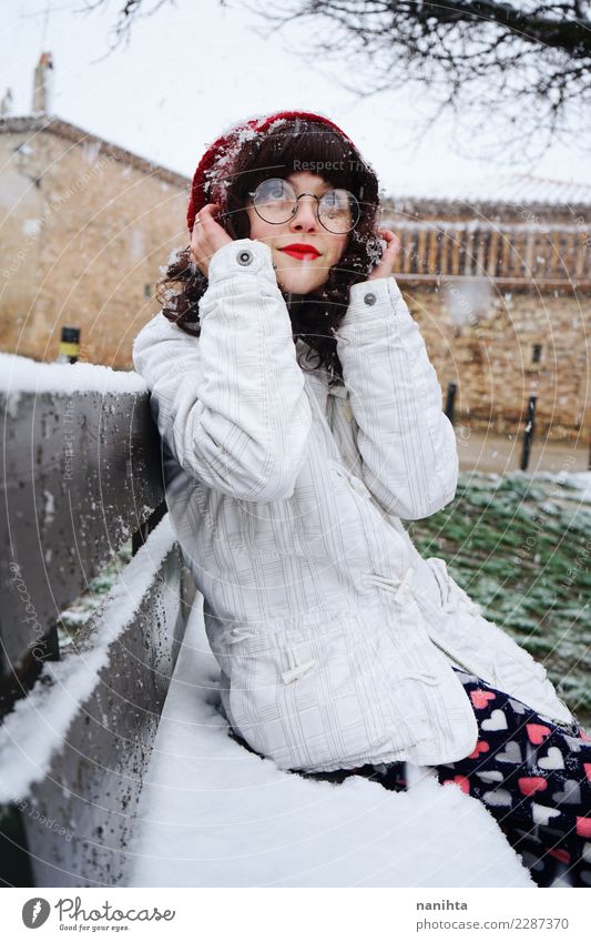 Young woman enjoying a snowy day sitting on a bench Lifestyle Style Wellness Senses Relaxation Human being Feminine Youth (Young adults) 1 18 - 30 years Adults