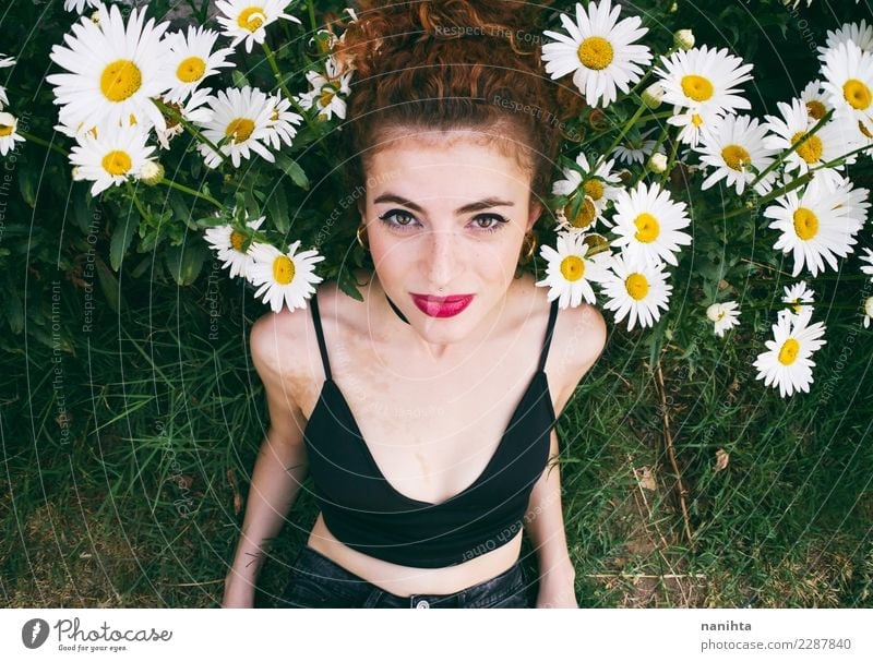 Young woman posing in a garden of daisies Lifestyle Elegant Style Beautiful Hair and hairstyles Wellness Harmonious Senses Human being Feminine