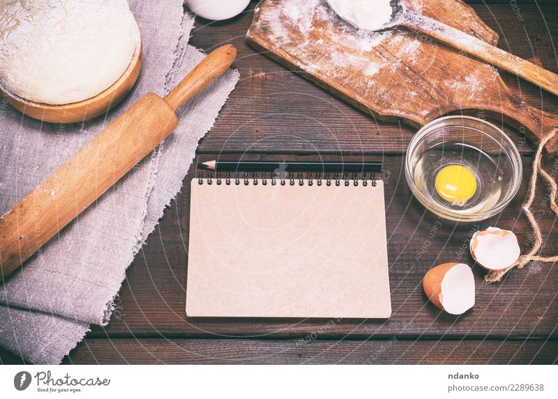 dough with ingredients on a brown wooden table Food Dough Baked goods Bread Bowl Spoon Table Kitchen Paper Wood Eating Fresh Natural Above Brown White Pencil
