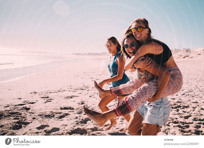 Happy best friends having good time on the beach together Joy Leisure and hobbies Vacation & Travel Beach Friendship Sunglasses Smiling Carrying Embrace Wild