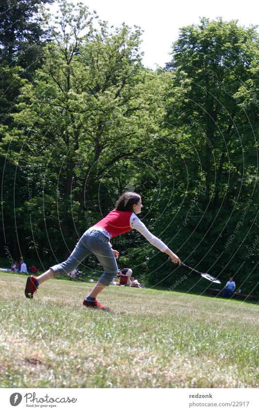 Girl plays badminton Badminton Meadow Tree Ball sports Playing Red Sports Nature Crazy Running Joy Tilt