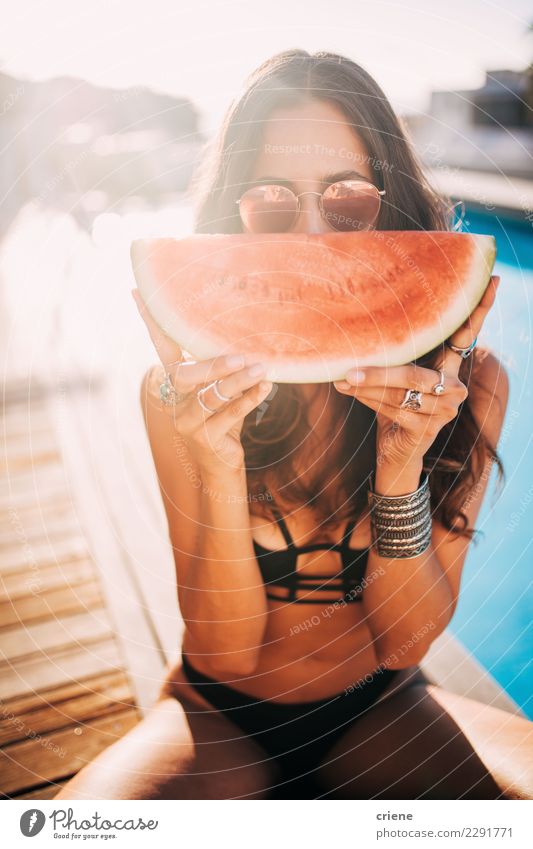 Woman enjoying watermelon on summer day at the swimming pool Fruit Eating Lifestyle Swimming pool Vacation & Travel Summer Adults Youth (Young adults)