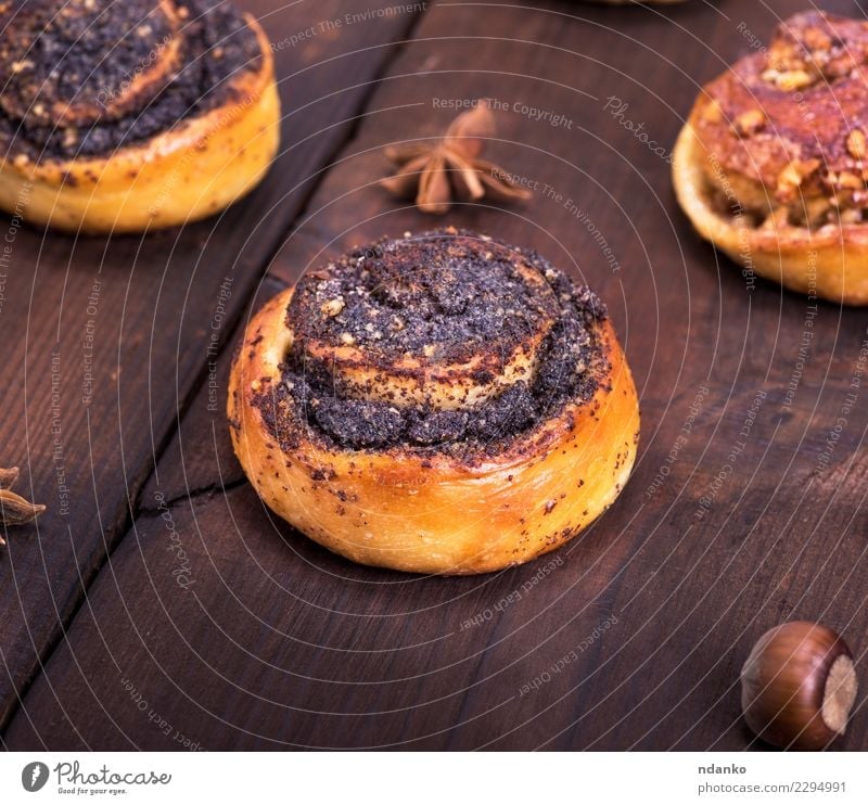 round poppy and nut buns Roll Dessert Breakfast Table Kitchen Wood Eating Fresh Delicious Natural Above Brown Tradition Home-made empty space Bakery Cinnamon