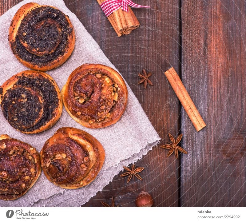 round poppy and nut buns Roll Dessert Candy Breakfast Table Wood Eating Fresh Delicious Above Brown Tradition food Poppy Rustic Bakery background sweet Cinnamon