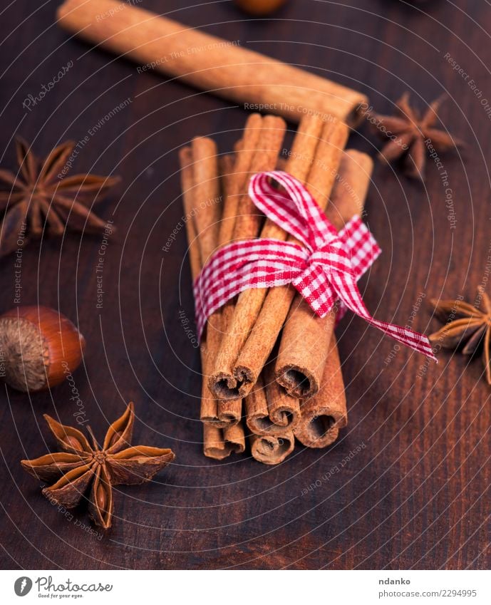 brown cinnamon sticks Food Herbs and spices Decoration Table Wood Dark Natural Brown Cinnamon background Rustic Ingredients star Aromatic anise Consistency