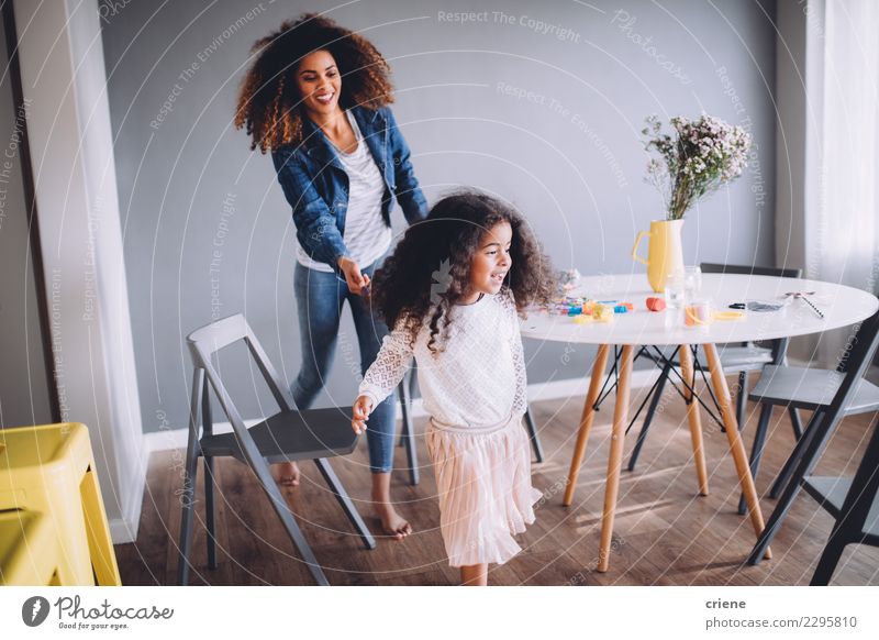 Mother and Daughter having fun at home. Joy Happy Playing Table Kindergarten Child School Woman Adults Parents Family & Relations Infancy Paper Pen Together