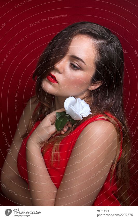 Romantic portrait of young woman on red background. Lifestyle Luxury Elegant Beautiful Cosmetics Perfume Healthy Health care Allergy Wellness Harmonious Calm