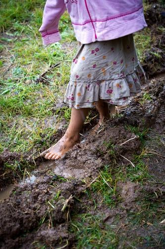 childhood Playing Parenting Child Feminine Girl Body 1 Human being 3 - 8 years Infancy Summer Autumn Meadow Muddy Skirt Going Poverty Authentic Wet Natural