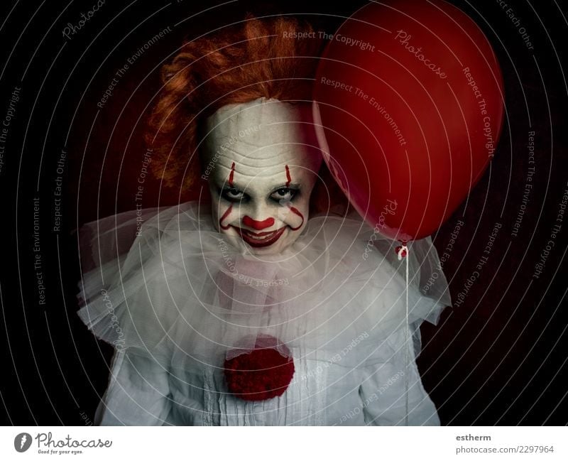 boy dressed as a clown on black background Lifestyle Entertainment Party Event Feasts & Celebrations Carnival Hallowe'en Fairs & Carnivals Human being Masculine
