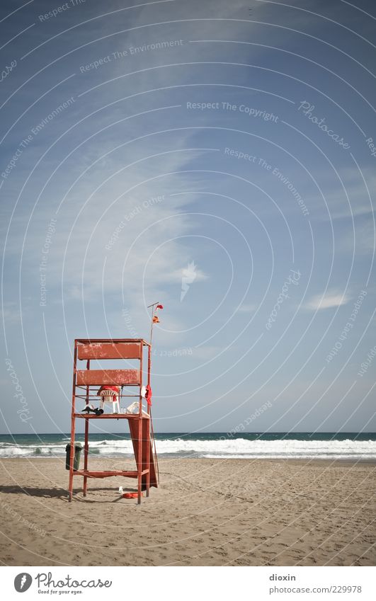 to the beautiful view Beach Ocean Waves Sky Clouds Sit Wait Lifeguard Colour photo Exterior shot Guard Watchfulness Copy Space top Copy Space middle Sandy beach