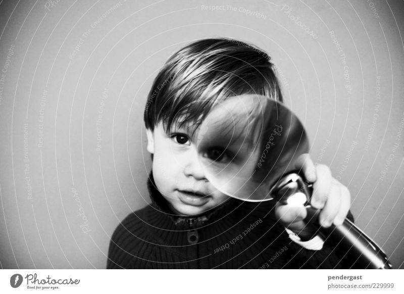 Magnifying glass with dwarf Human being Child Toddler Boy (child) Head 1 1 - 3 years Observe Curiosity Gray Enthusiasm Adventure Beginning Idea Perspective