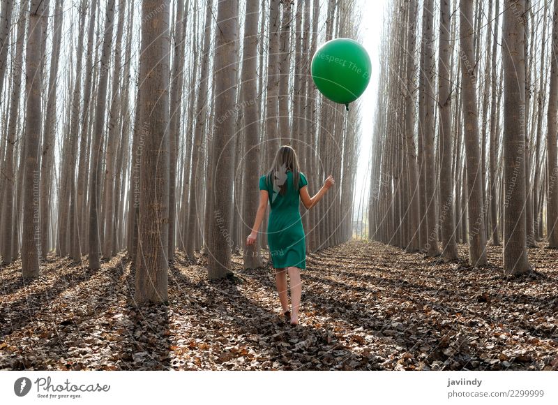 Young woman in poplar forest with green dress and balloon Lifestyle Joy Beautiful Relaxation Human being Woman Adults Youth (Young adults) 1 18 - 30 years