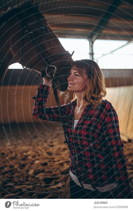 Mature woman is cuddling her horse Lifestyle Ride Human being 30 - 45 years Adults Animal Farm animal Horse One animal Advice Vacation & Travel Adventure