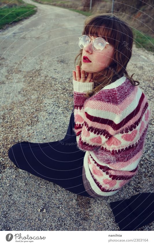 Young woman wearing retro clothes is sitting in an old road Lifestyle Style Design Human being Feminine Youth (Young adults) 1 18 - 30 years Adults Street