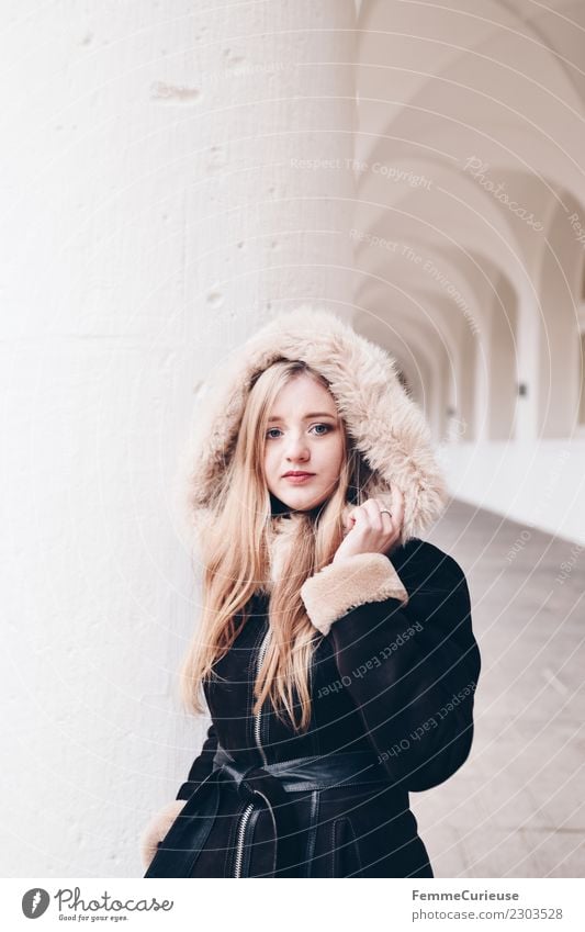 Young woman wearing a coat with fur collar Lifestyle Elegant Style Feminine Youth (Young adults) Woman Adults 1 Human being 18 - 30 years Fashion Beautiful