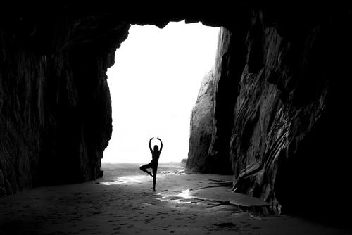Dancing mood, In the cave on the beach the young woman dances Feminine 1 Human being Landscape Water Summer Beautiful weather Rock coast Beach Ocean Cave
