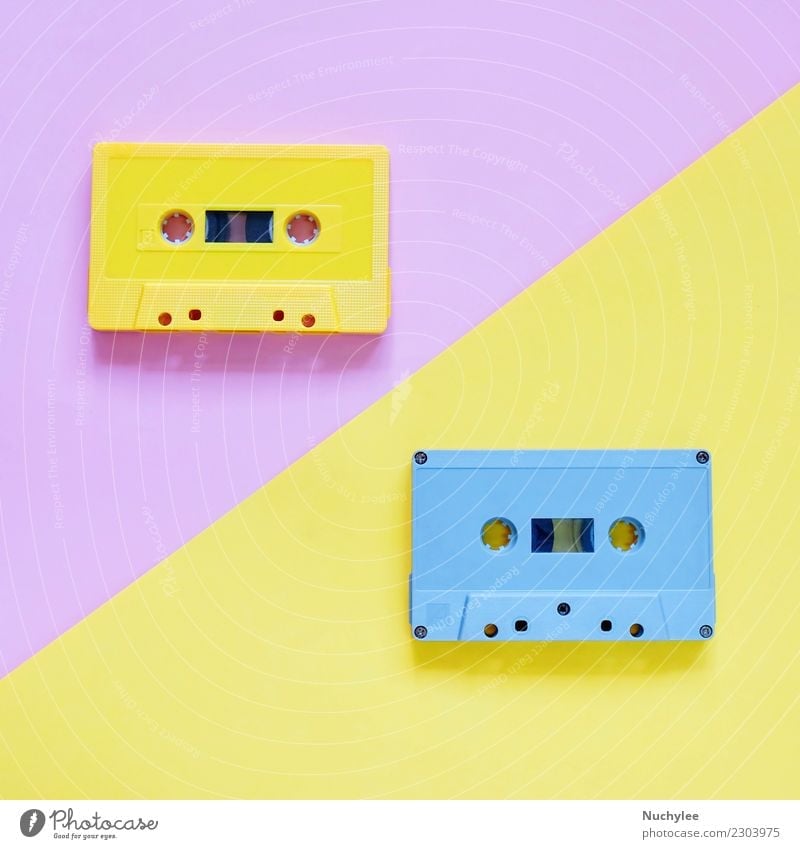 Retro cassette tapes on pastel color background Style Design Entertainment Music Media Plastic Old Listening Yellow Pink Black Colour Nostalgia Tape cassette
