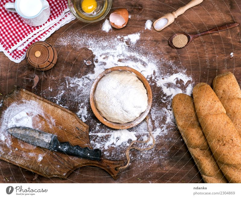 process of cooking bread from a yeast dough Dough Baked goods Bread Roll Bowl Spoon Table Kitchen Wood Fresh Natural Brown White Yeast background Preparation