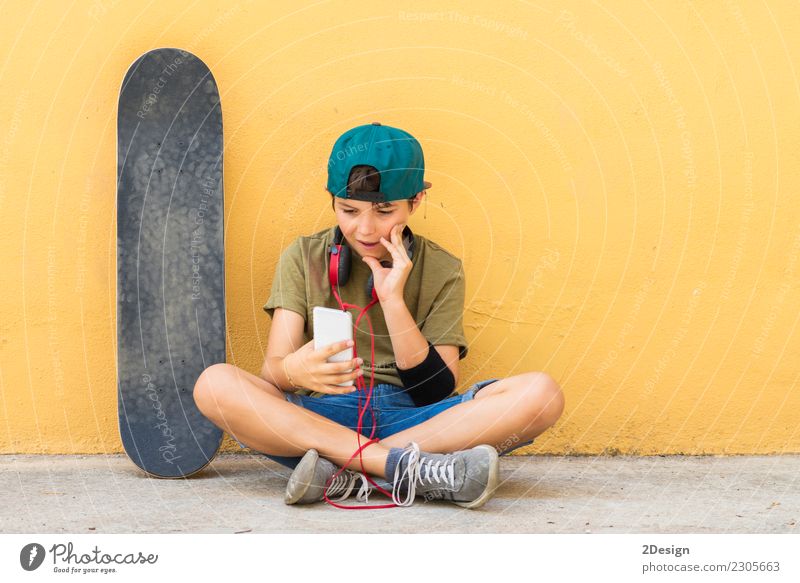 Portrait of a teenager sitting on the floor Lifestyle Beautiful Face Leisure and hobbies Freedom Music Telephone Headset PDA Technology Internet Human being