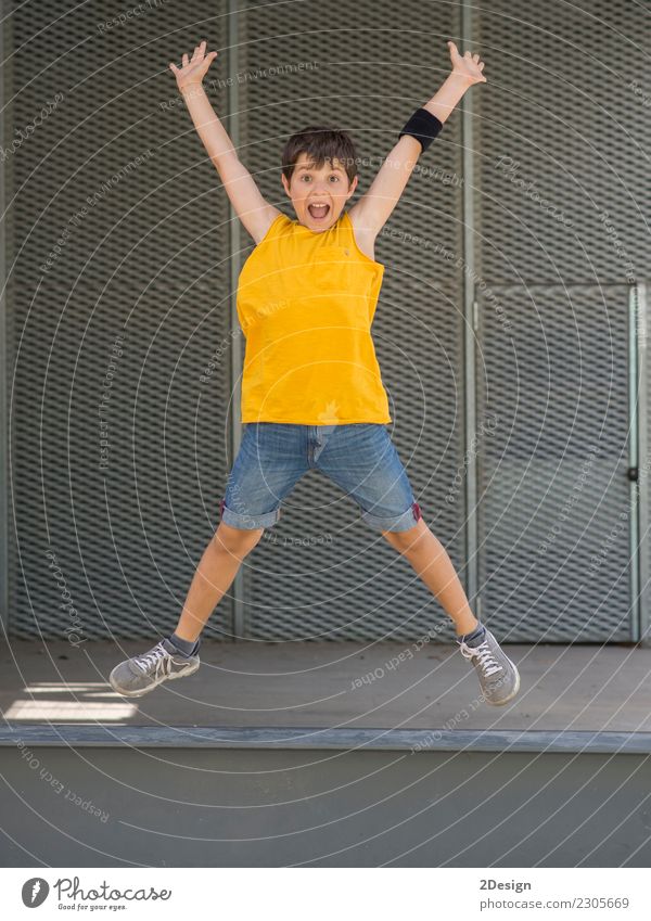 A young teen wearing yellow T-shirt and jumping Lifestyle Joy Freedom Summer Sports Success Child Boy (child) Man Adults Youth (Young adults) Arm Meadow