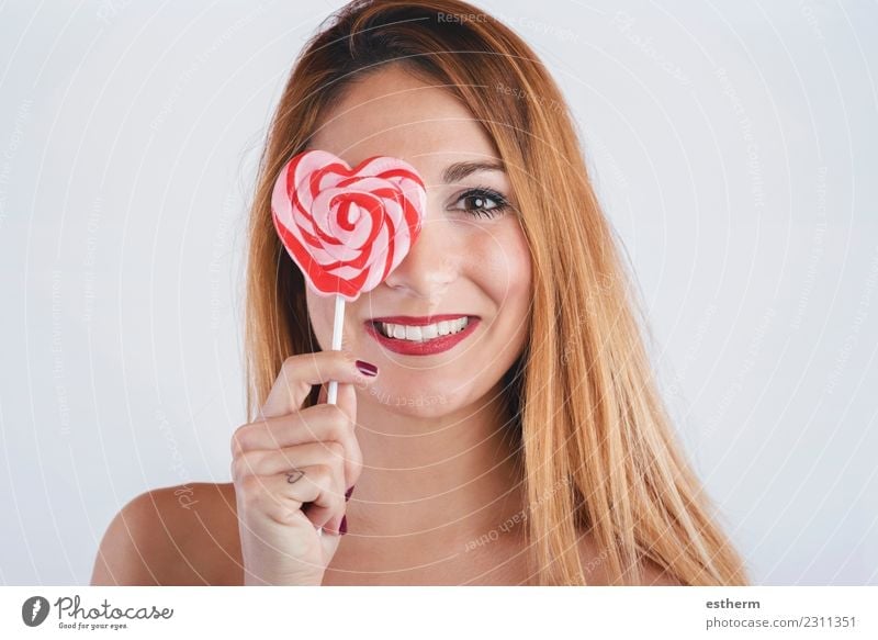 Portrait of smiling girl with heart shaped lollipop Lifestyle Joy Beautiful Wellness Feasts & Celebrations Valentine's Day Human being Feminine Young woman