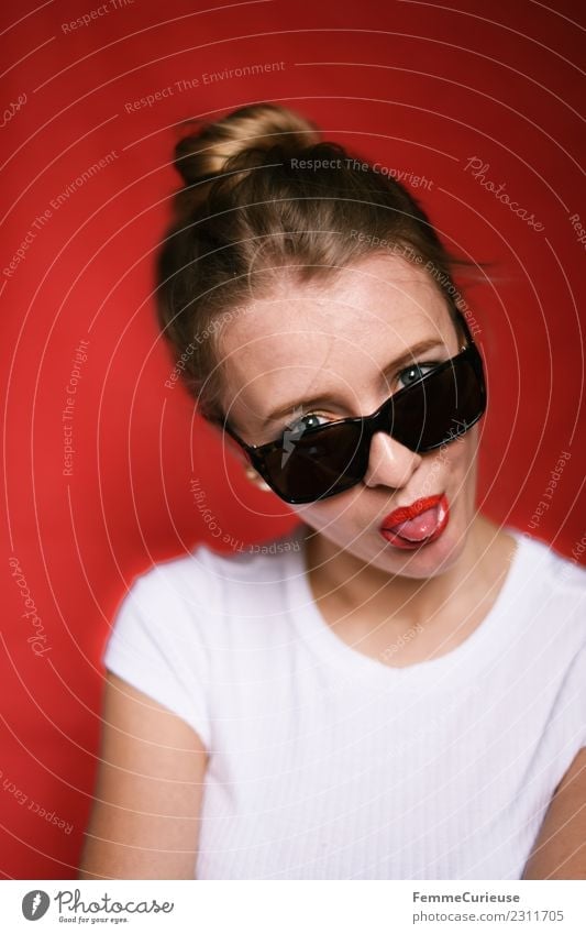 Young woman with sunglasses stretching out tongue Style Feminine Youth (Young adults) Woman Adults 1 Human being 18 - 30 years Beautiful Brash Cool (slang)