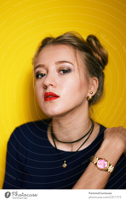 Young woman posing in front of yellow background Feminine Youth (Young adults) Woman Adults 1 Human being 18 - 30 years Beautiful Lipstick Wearing makeup