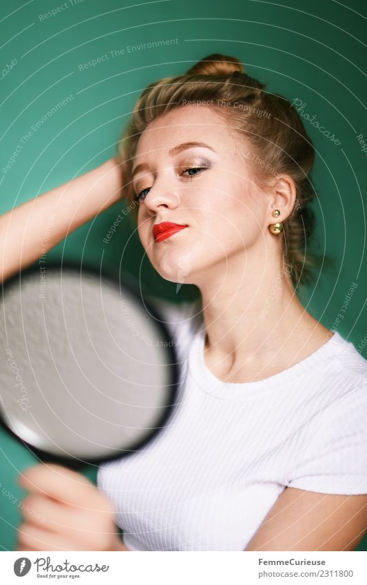 Blonde girl looking at herself in a mirror Feminine Young woman Youth (Young adults) Woman Adults 1 Human being 18 - 30 years Beautiful Mirror Mirror image