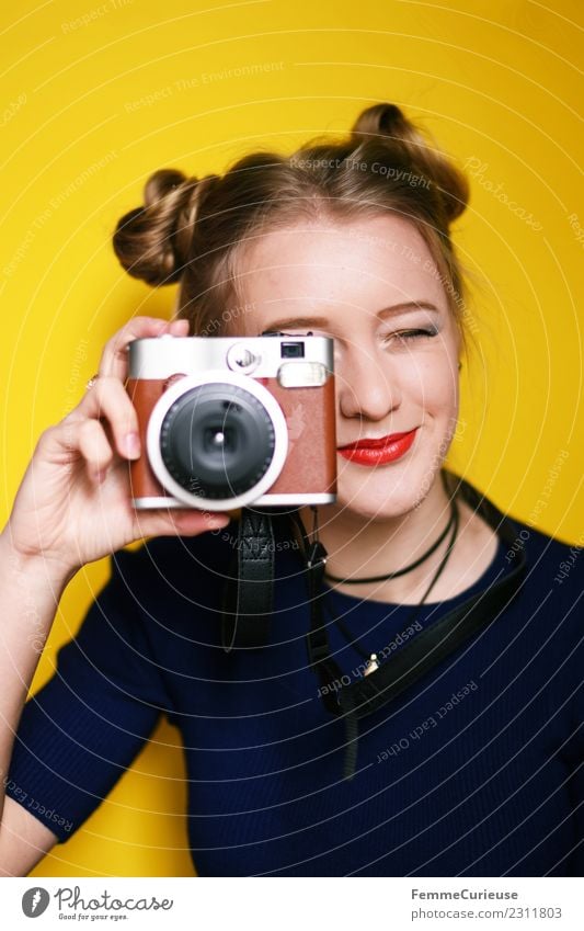 Young woman taking pictures with an instant camera Technology Feminine Youth (Young adults) Woman Adults 1 Human being 18 - 30 years Creativity Instant camera