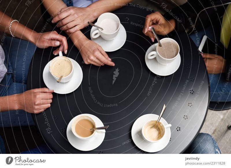 Hands with coffee cups on table in a urban cafe. Breakfast Beverage Coffee Lifestyle Shopping Table Meeting To talk Friendship Group Heart Together Hot Brown