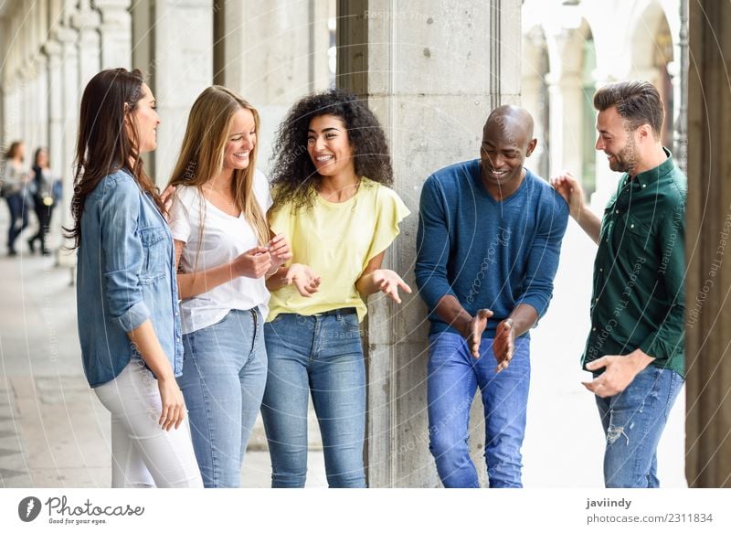 Multi-ethnic group of young people having fun together outdoors in urban background Lifestyle Joy Happy Beautiful Summer Human being Young woman