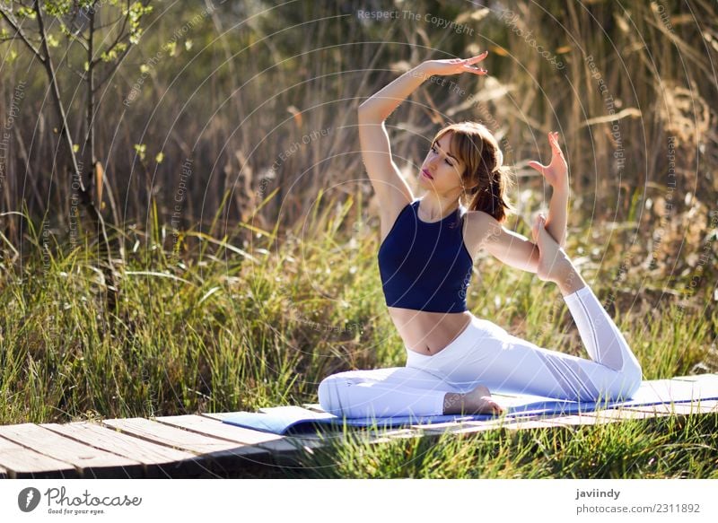 Young woman doing yoga in nature. Lifestyle Beautiful Body Wellness Relaxation Meditation Sports Yoga Human being Youth (Young adults) Woman Adults 1